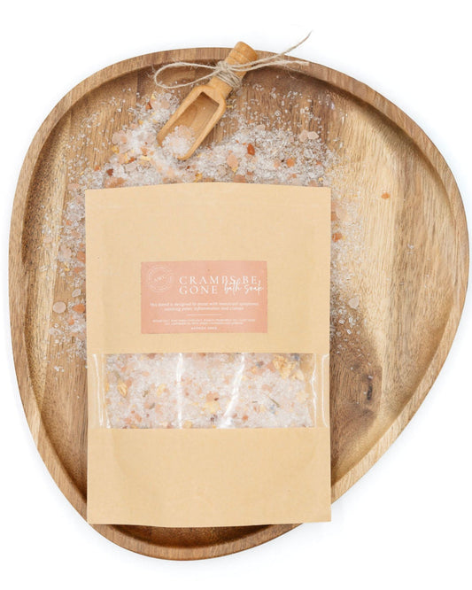 Wooden tray with a package of Emsifel Fine Sea Salt on a white background