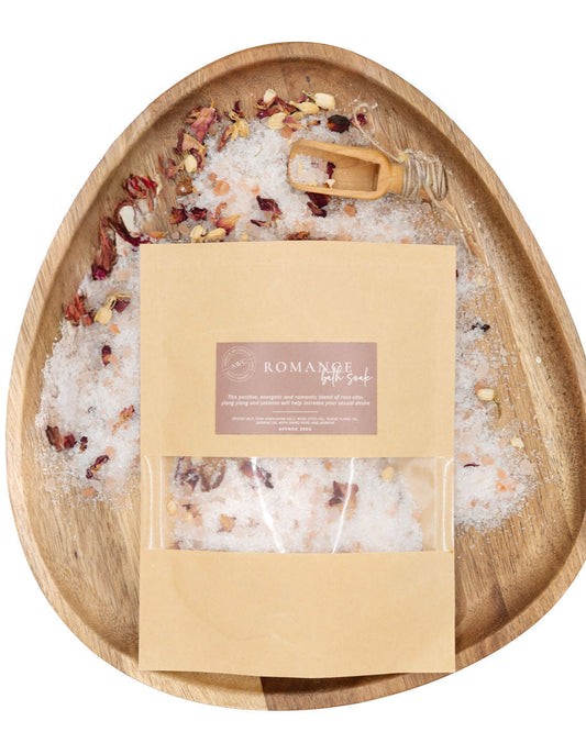 Bath salt package with decorative elements on a wooden tray